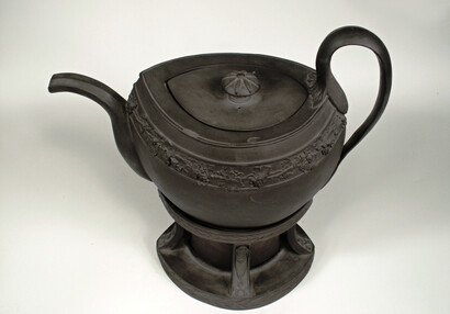 Teapot with stand for heating