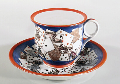 Cup and saucer with playing card motif