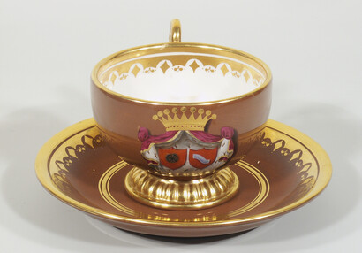 Cup and saucer with heraldic motif