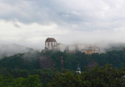 View of the chateau from the river in the morning mist